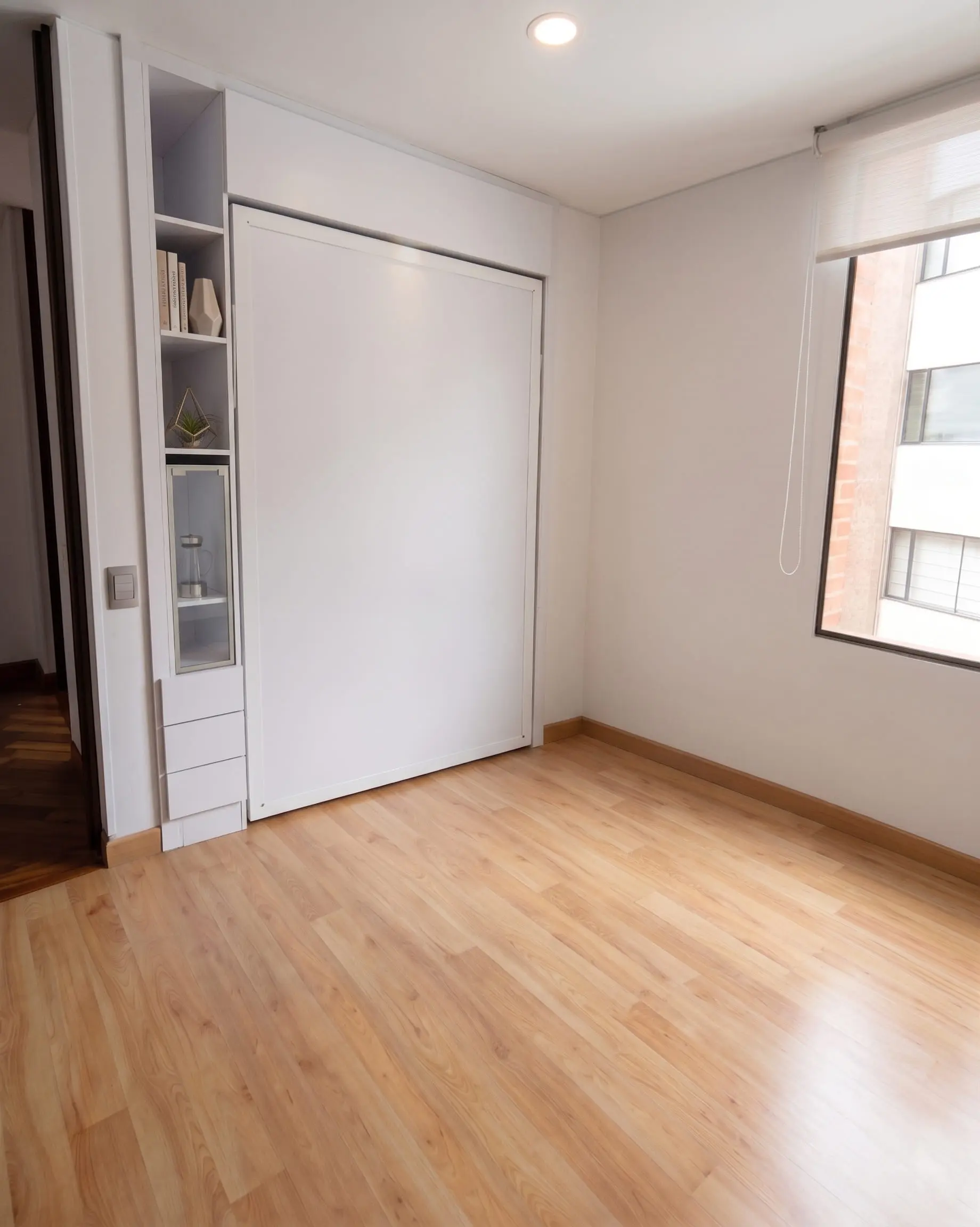 Cama abatible de diseño premium ABAUL integrada en salón minimalista moderno.